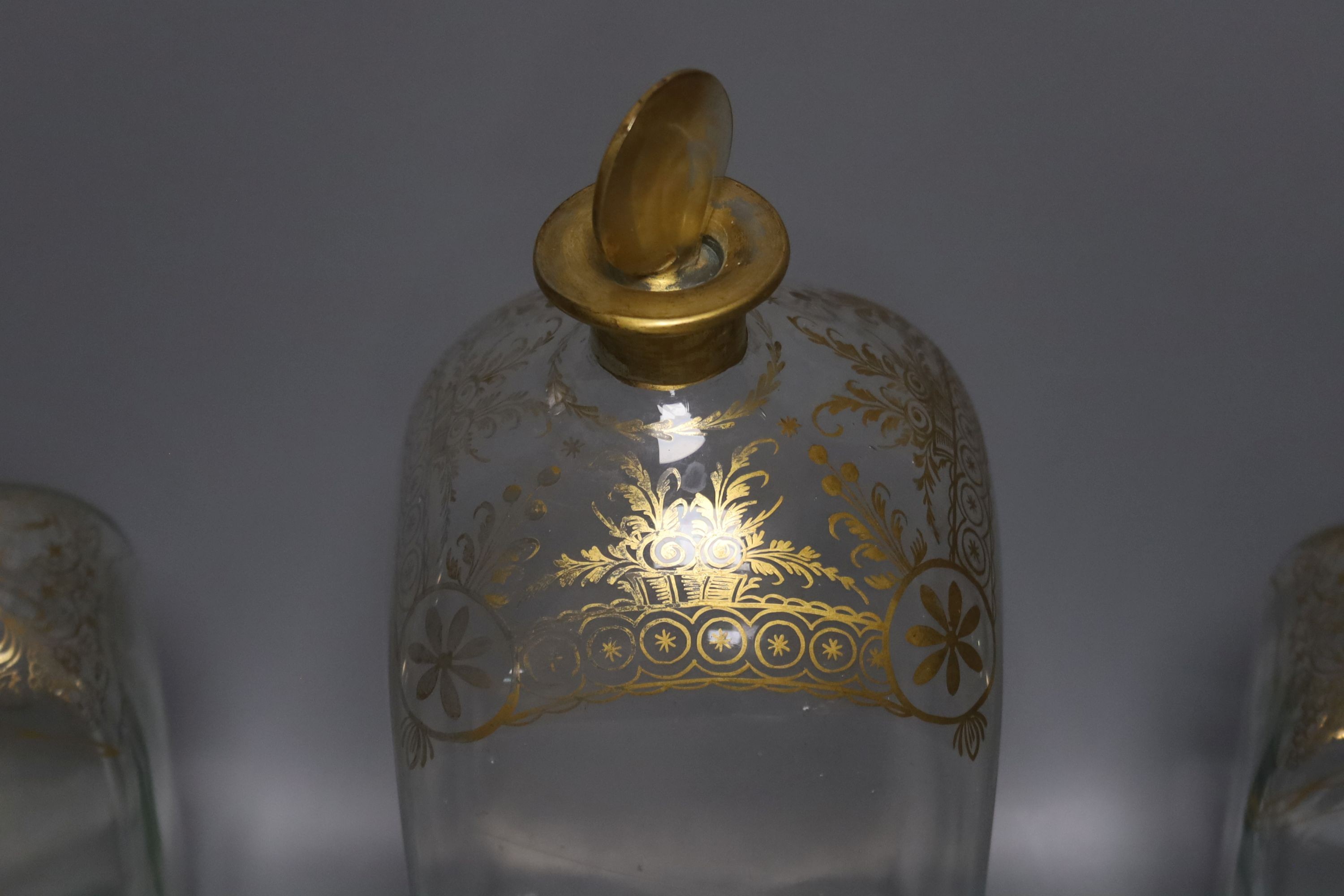 A Regency style decanter with lozenge-shaped stopper, a pair of gilt-decorated Spanish 'Jerez' decanters, a similar larger decanter and five other decanters